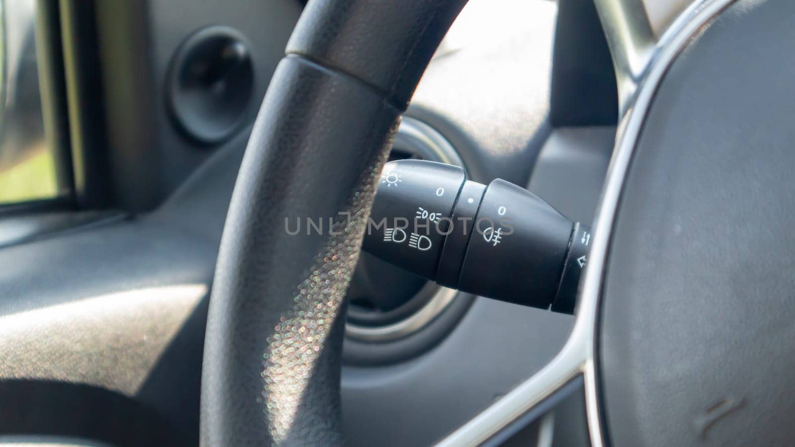 Detailing the car. Close-up of the left arm of the car turn signal. Gearshift light in the interior of the car