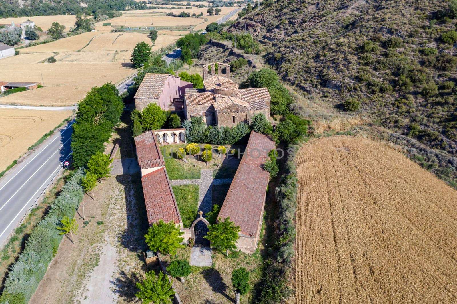 Church of Santa Maria of the Priorat in Castellfollit de Riubregos, Anoia Spain. Declared cultural heritage of national interest. View from cemetery with detail of the cross