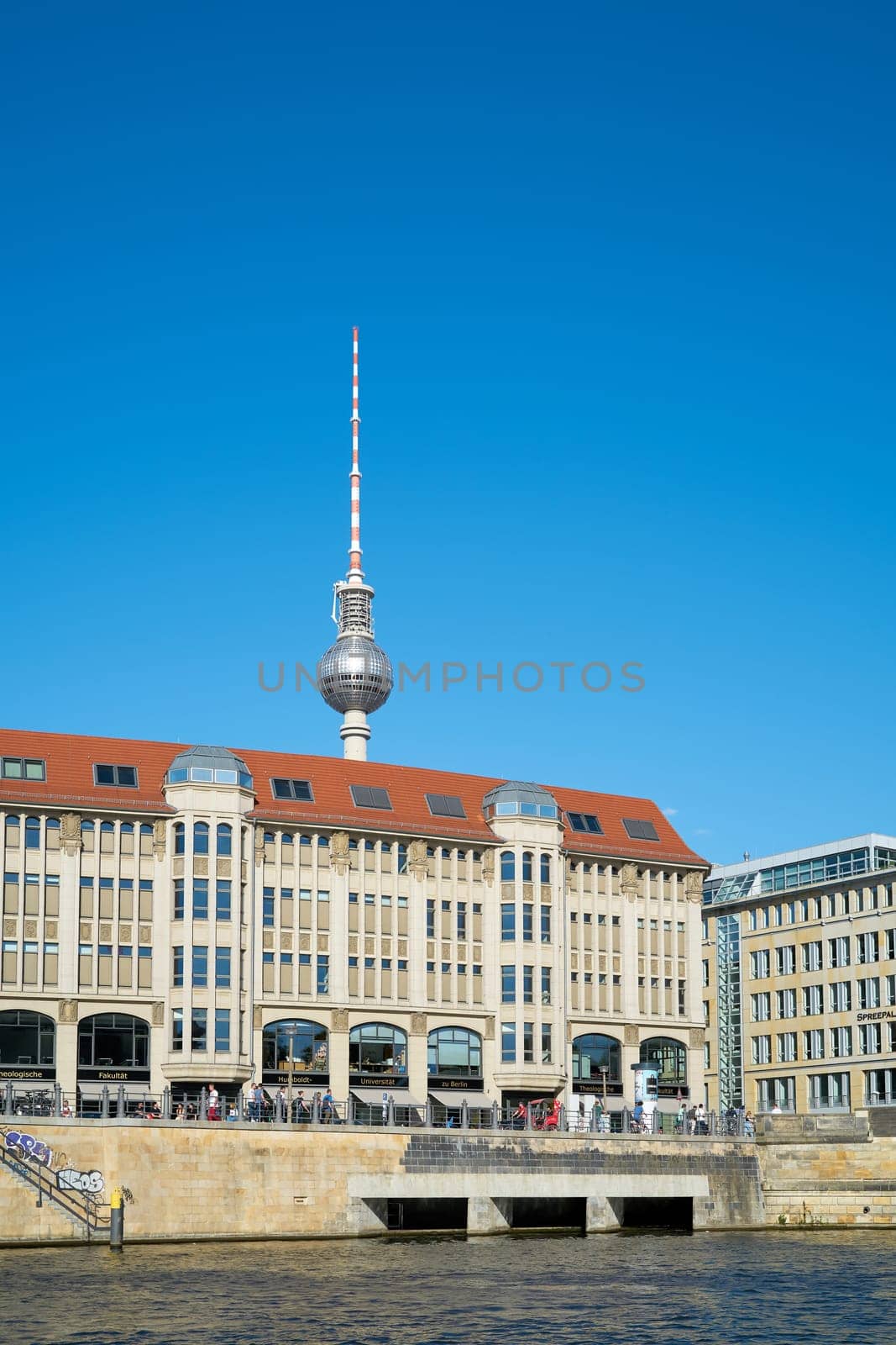 City view of Berlin with television tower in background seen from Spree river