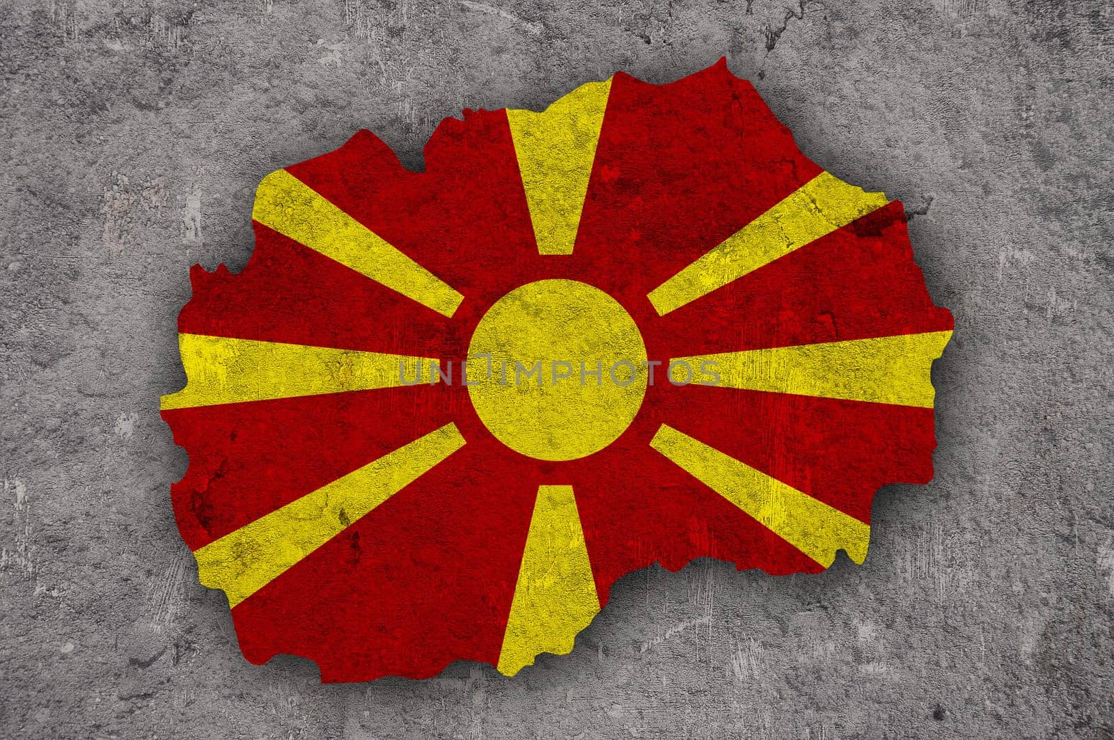 Map and flag of North Macedonia on weathered concrete