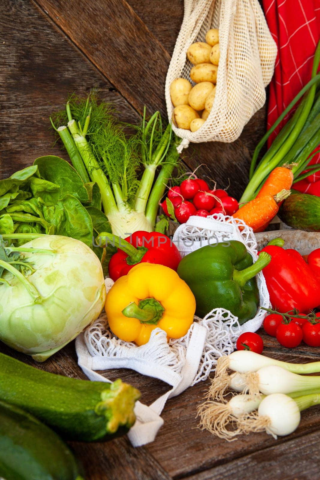 Colorful variety of fresh vegetables on rustic wooden background