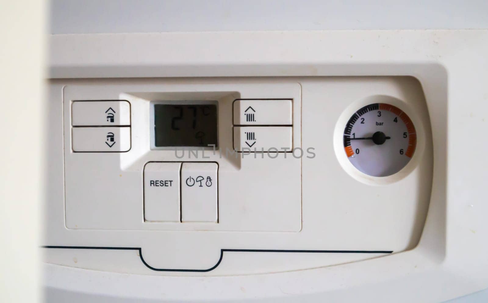 Internal control of a gas double-circuit boiler with a pressure and temperature sensor in the home heating system, close. Energy saving and image efficient home concept. Selective focus