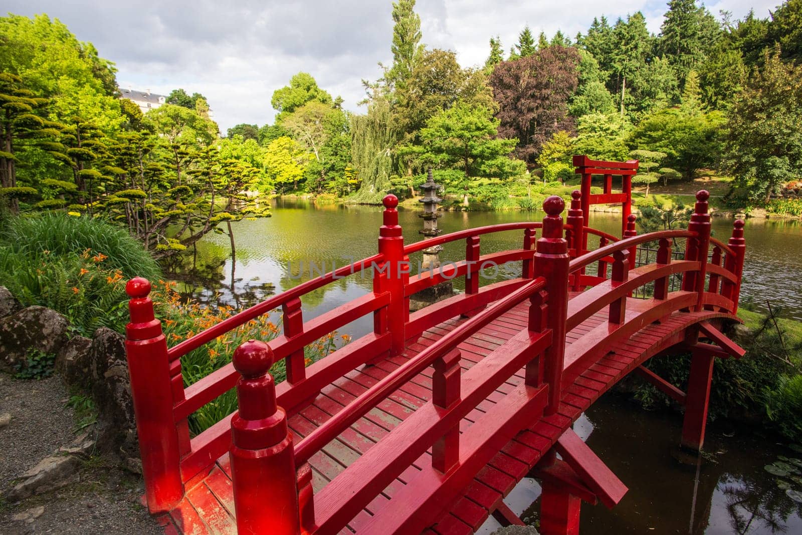 Red bridge in Japanese garden in spring