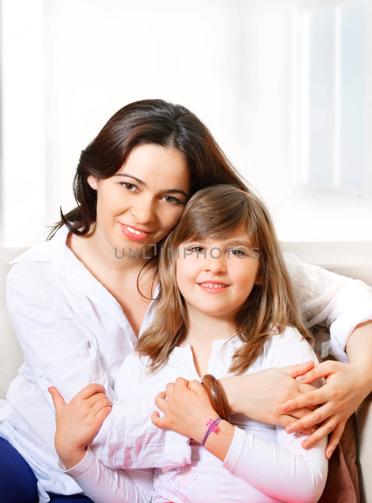 Portrait of happy mother and her smililing daugther