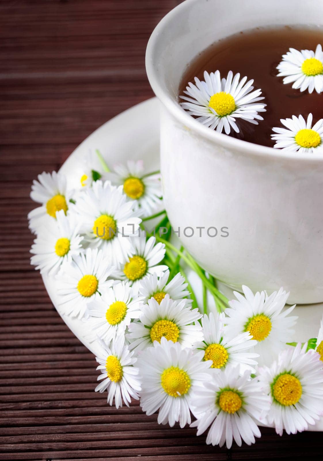 Cup of natural tea on dark background