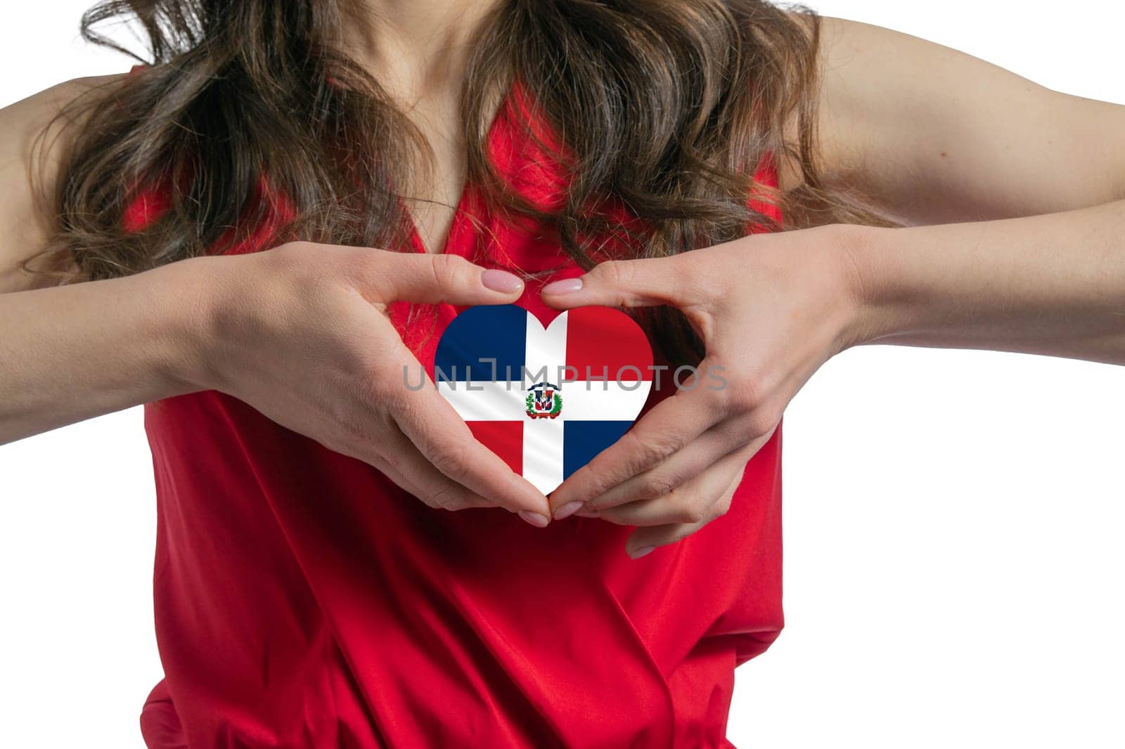 Love Dominican Republic The woman holds a heart in the form of the flag of Dominican Republic on her chest. Concept of patriotism.