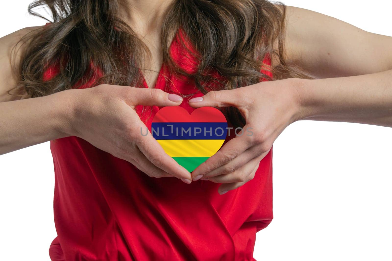 Love Mauritius. The woman holds a heart in the form of the flag of Mauritius on her chest. Concept of patriotism.