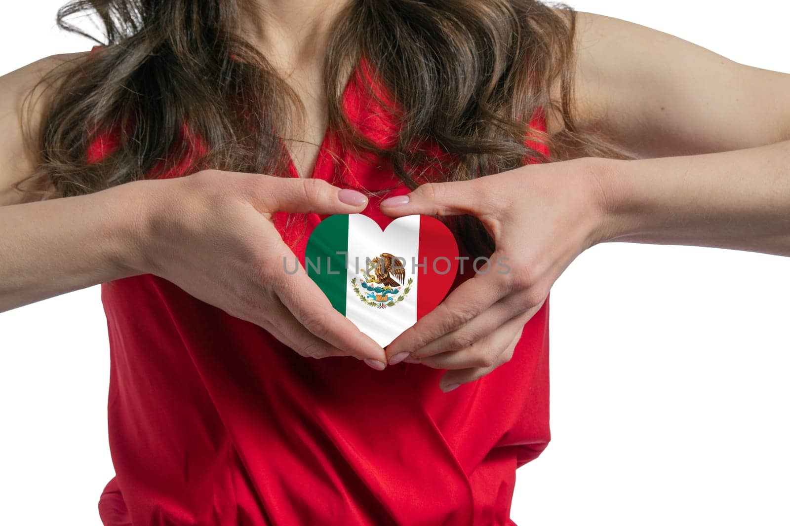 Love Mexico. The woman holds a heart in the form of the flag of Mexico on her chest. Concept of patriotism.