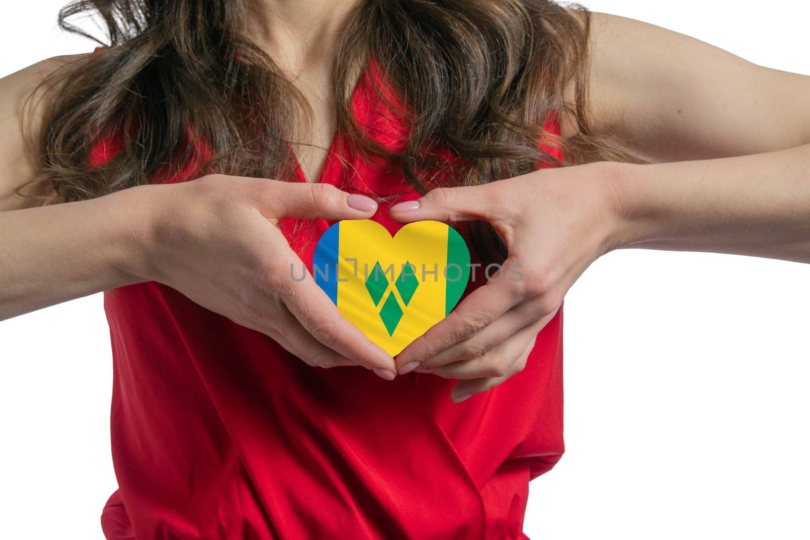 Love Saint Vincent and the Grenadines. The woman holds a heart in the form of the flag of Saint Vincent and the Grenadines on her chest. Concept of patriotism.
