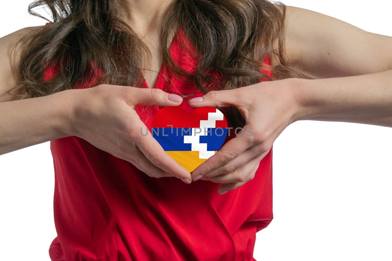 Love Nagorno-Karabakh Republic. The woman holds a heart in the form of the flag of Nagorno-Karabakh Republic on her chest. Concept of patriotism.