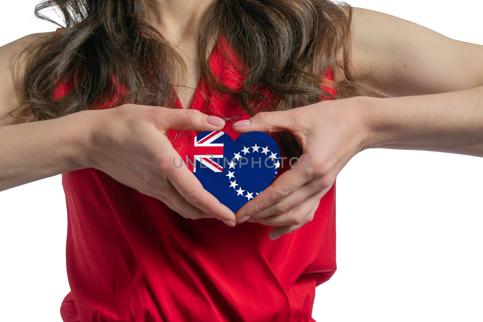 Love Cook Islands. The woman holds a heart in the form of the flag of Cook Islands on her chest. Concept of patriotism.