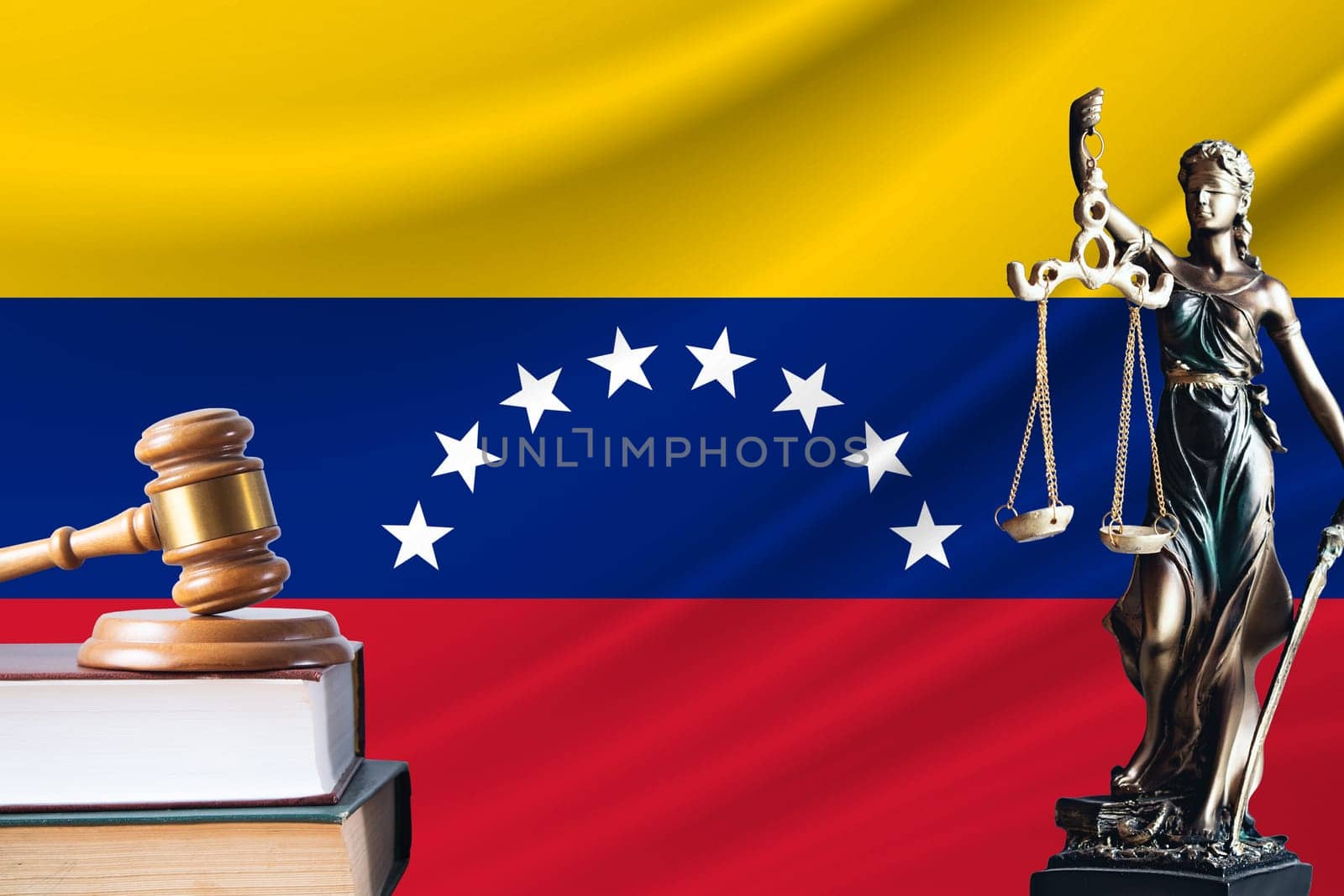 Law and justice in Venezuela. Statue of themis and the gavel of the judge against the background of the flag of Venezuela. Law and justice concept.