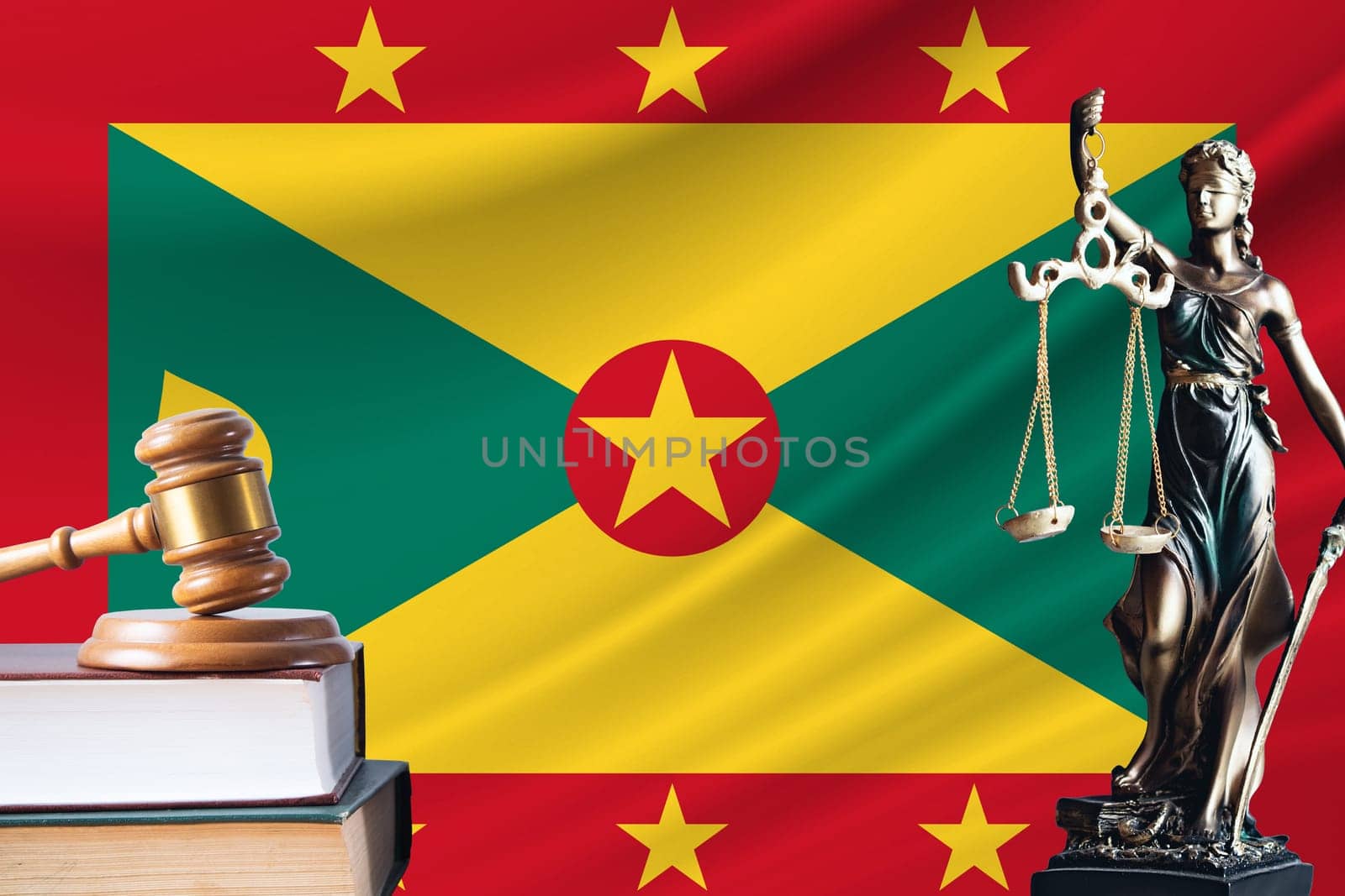 Law and justice in Grenada. Statue of themis and the gavel of the judge against the background of the flag of Grenada. Law and justice concept.