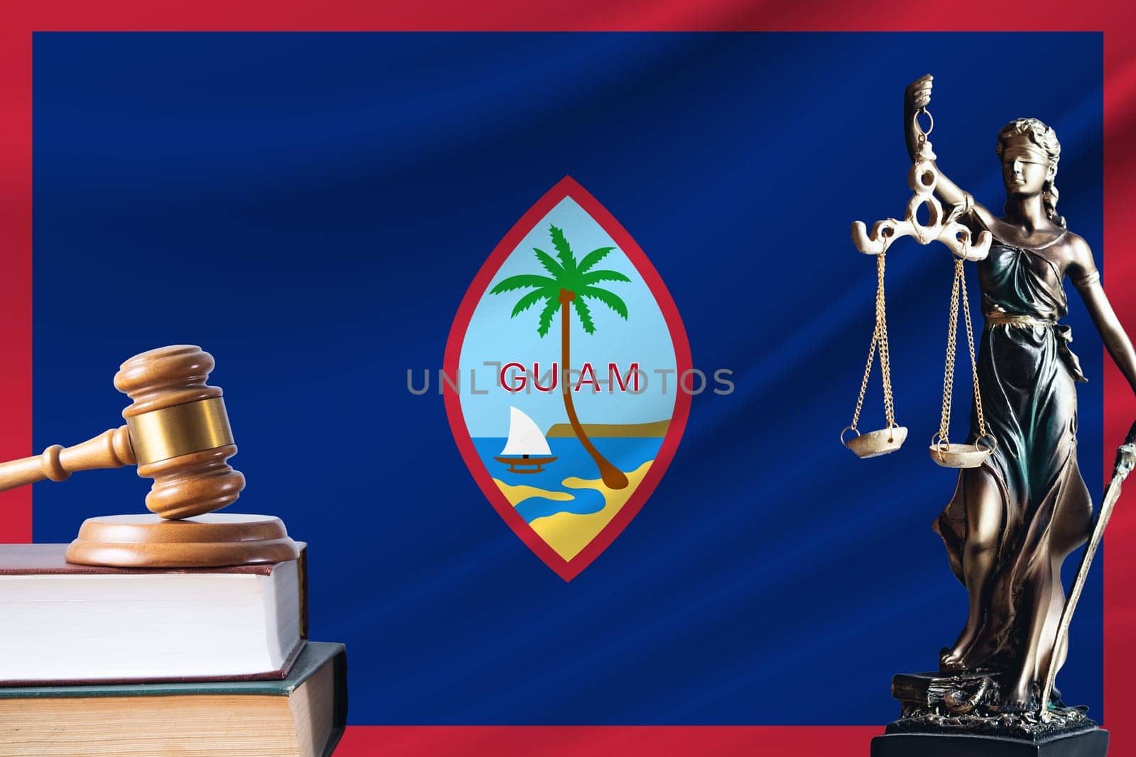 Law and justice in Guam. Statue of themis and the gavel of the judge against the background of the flag of Guam. Law and justice concept.