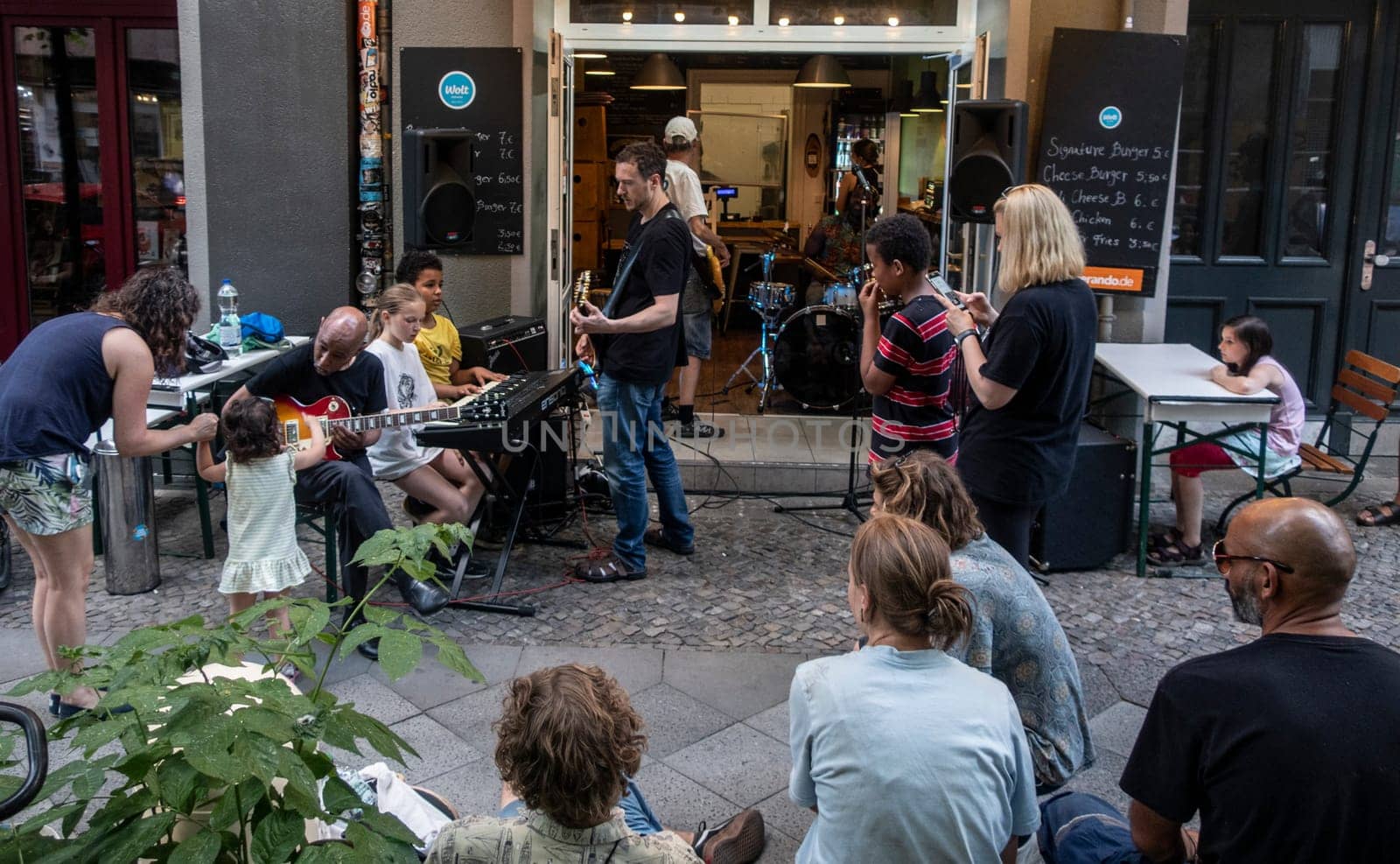 Musicians play during Summer solsticem 2021 in a Burgershop in Berlin while offocial Fête de la Musique don't happen because of Corona pandemic