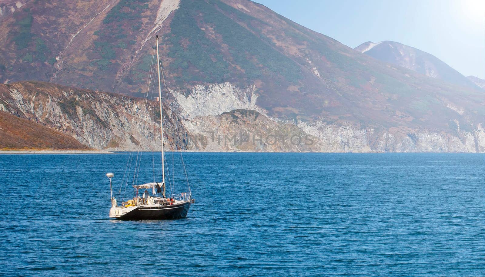 The Kamchatka peninsula. Pacific coast. Sailing yacht ship in the bay. Selective focus