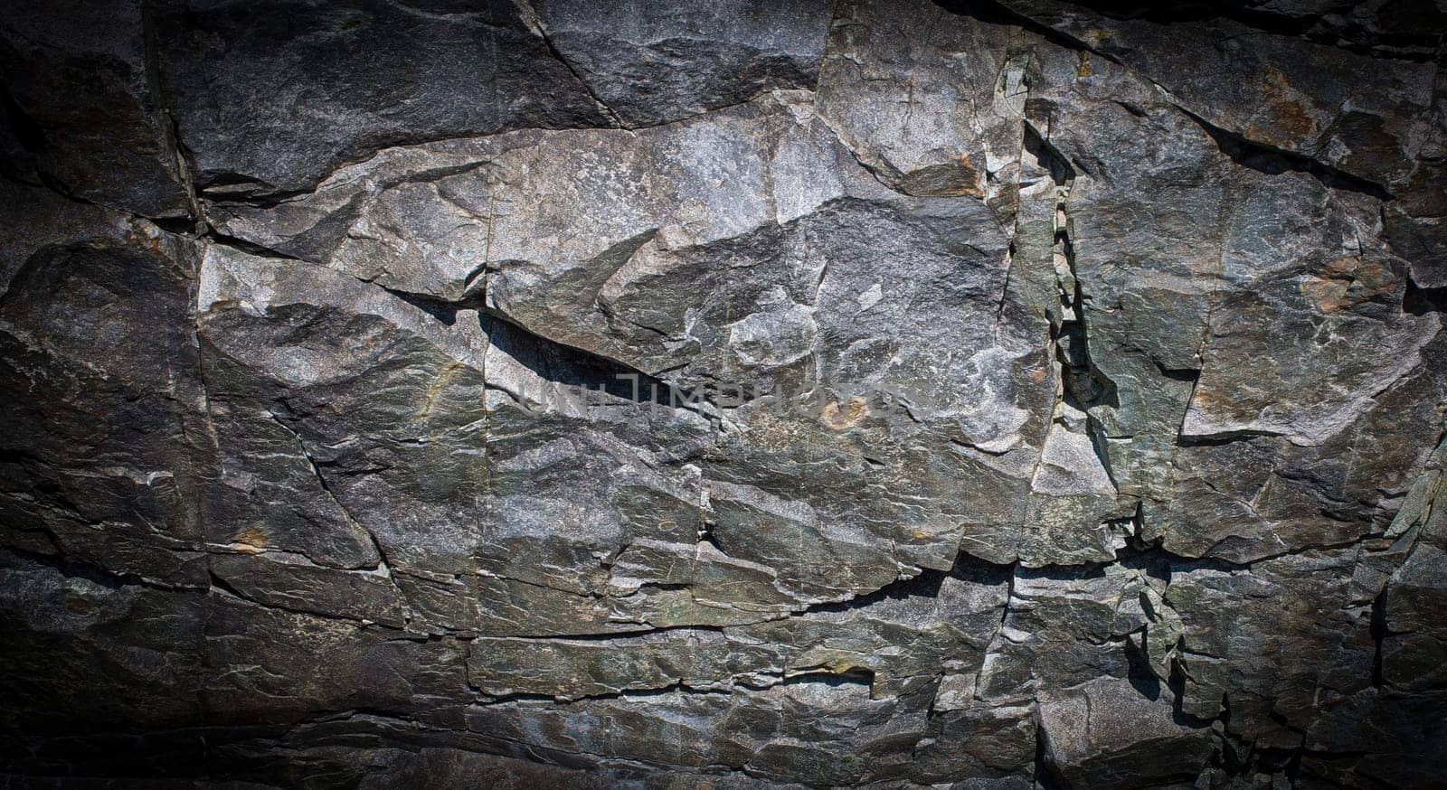 The Dark grey black stone background or texture. Selective focus