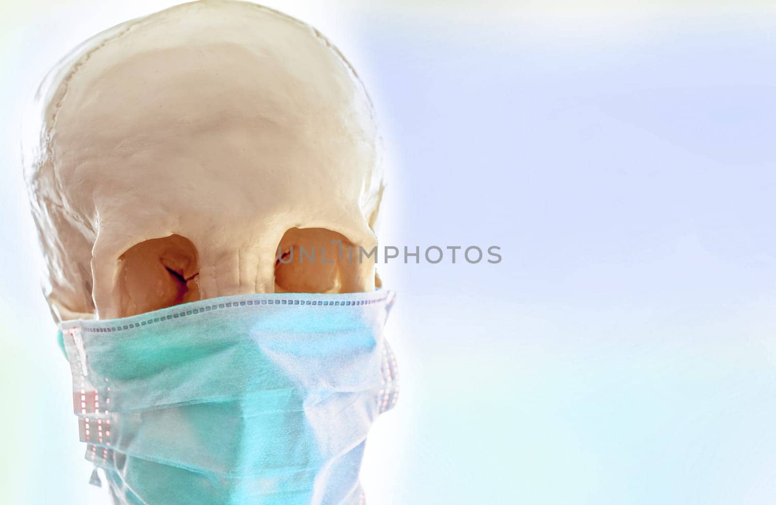 The Human skull in simple thin medical mask for protection against viral infection