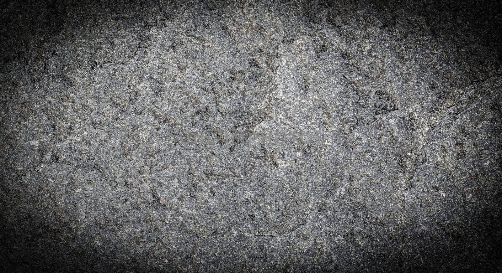 The Dark grey black stone background or texture. Selective focus