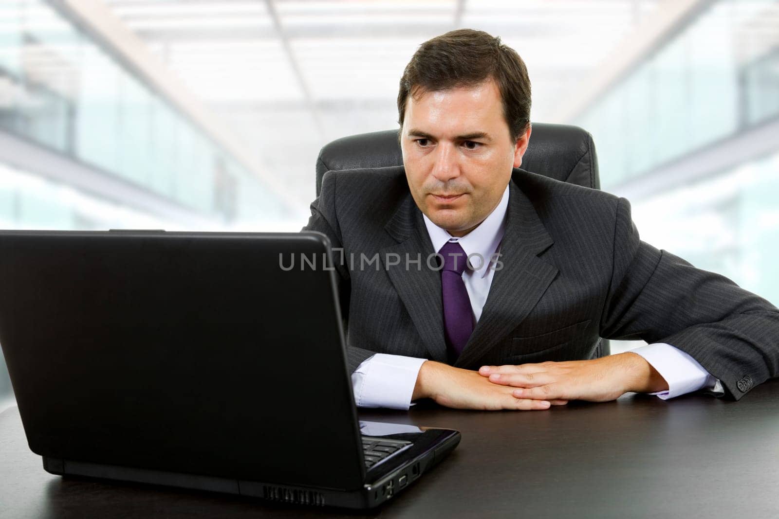 businessman working with is laptop at the office