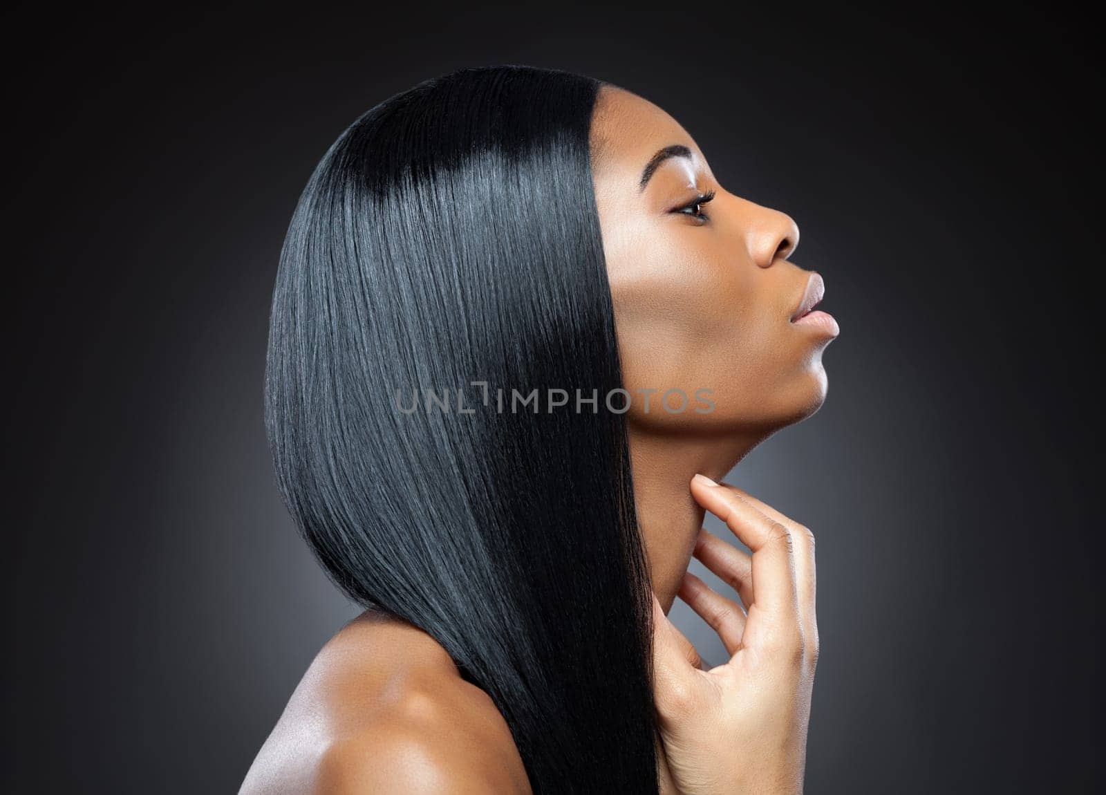 Profile of a black beauty with perfect straight and shiny hair