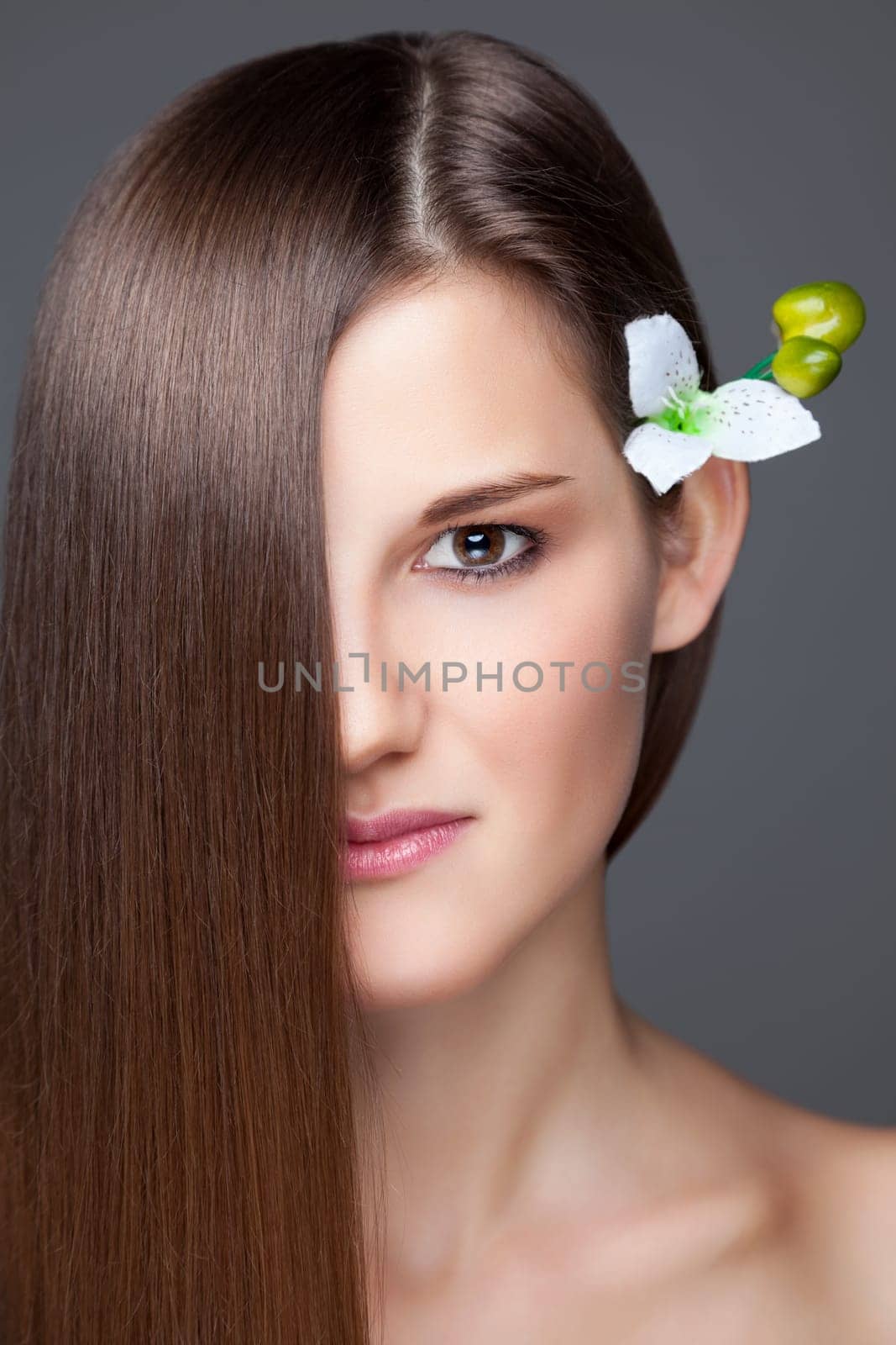 Beautiful young brunette with long straight hair