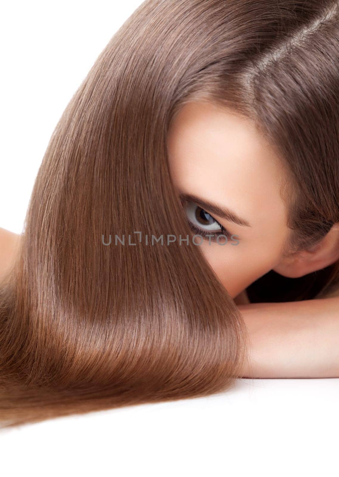 Beautiful young brunette with long straight and shiny hair