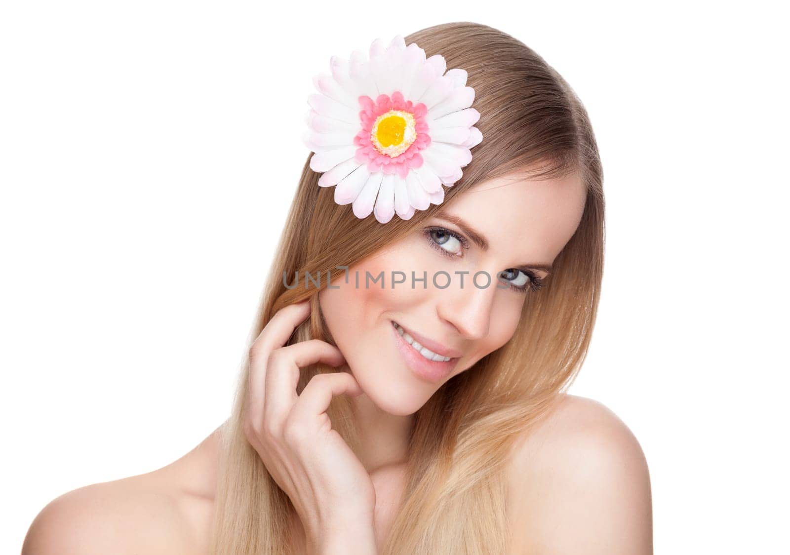Beautiful young woman with a flower in her hair