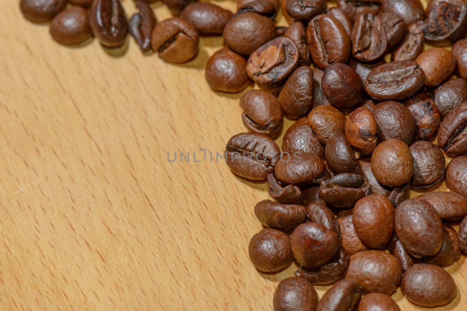 Macro of several toasted coffee seeds
