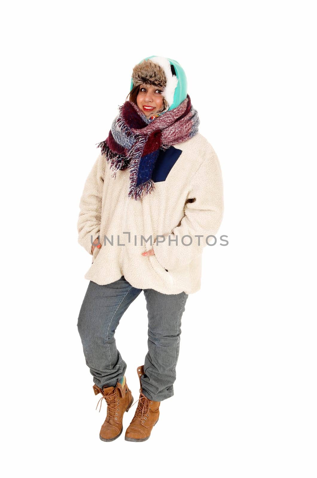 A lovely young woman with a big scarf around her neck and head,.dressed for very cold weather, isolated for white background..