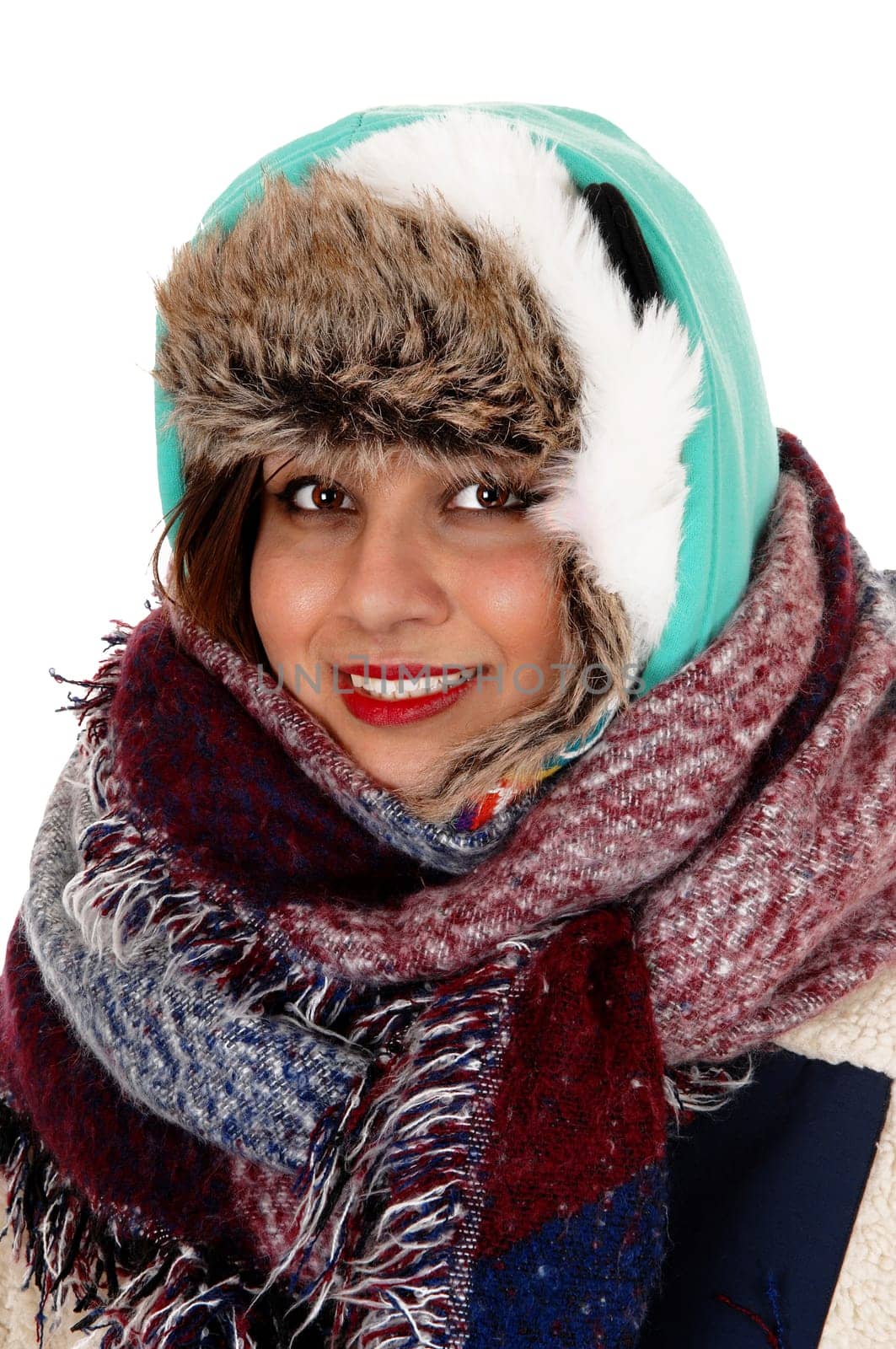 A lovely young woman with a big scarf around her neck and head,.dressed for very cold weather, isolated for white background..