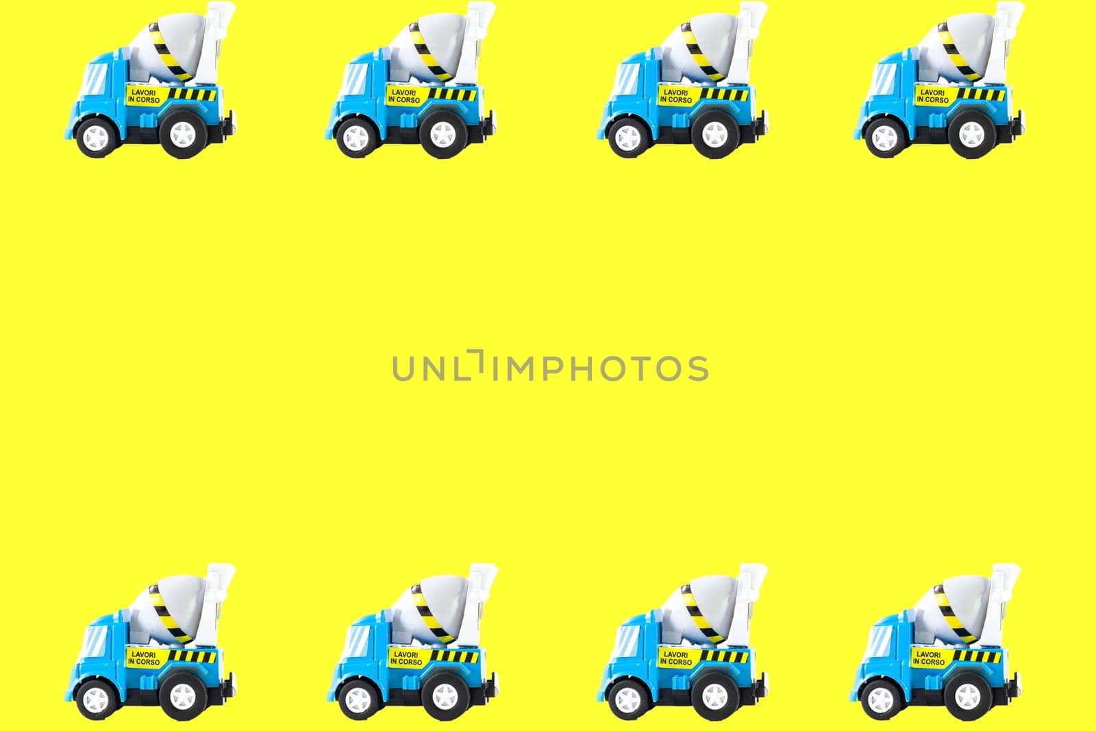 Frame of Toy cars. Concrete mixer Toys Truck. yellow background
