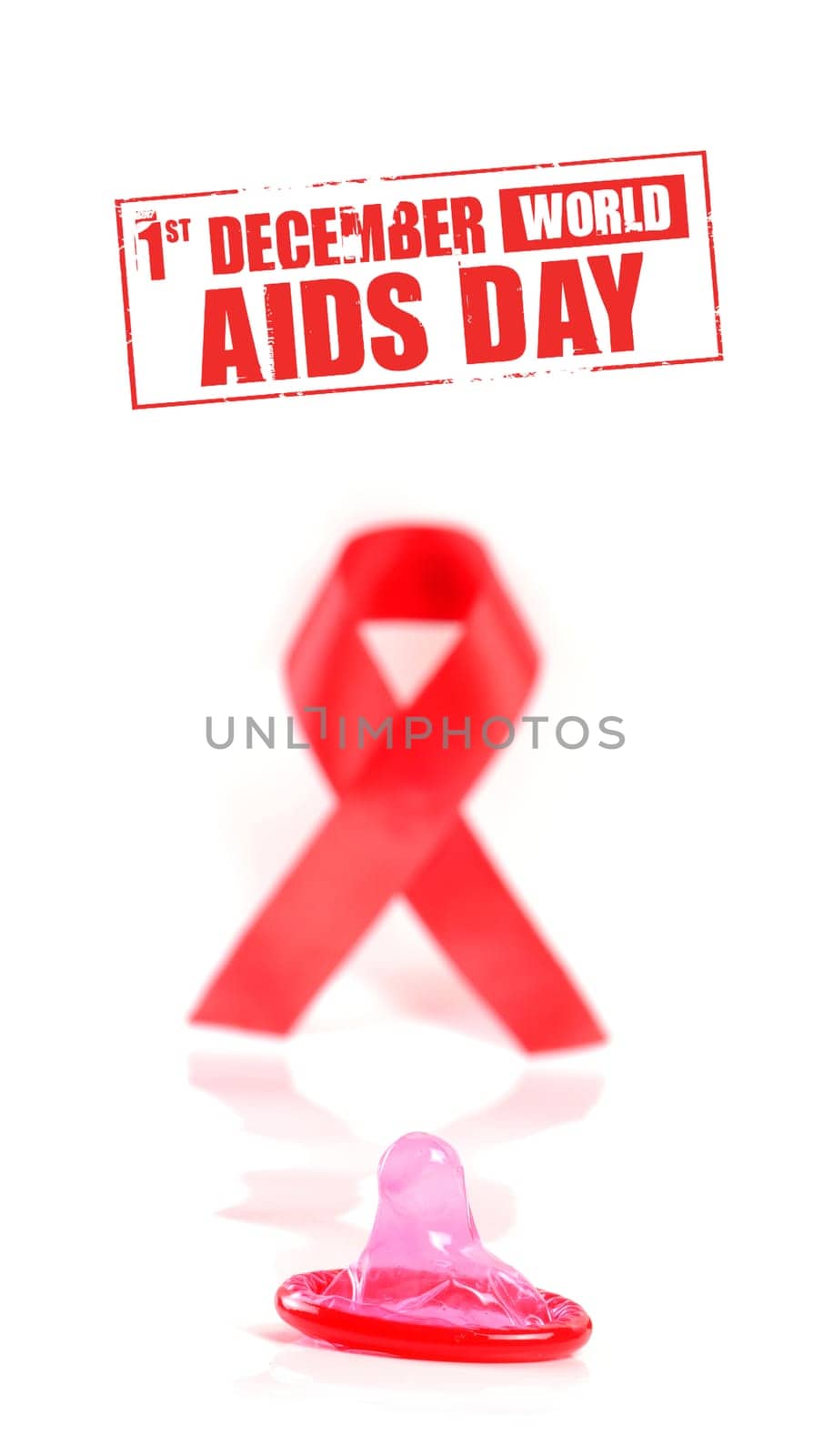 Aids ribbon and condom on white background.