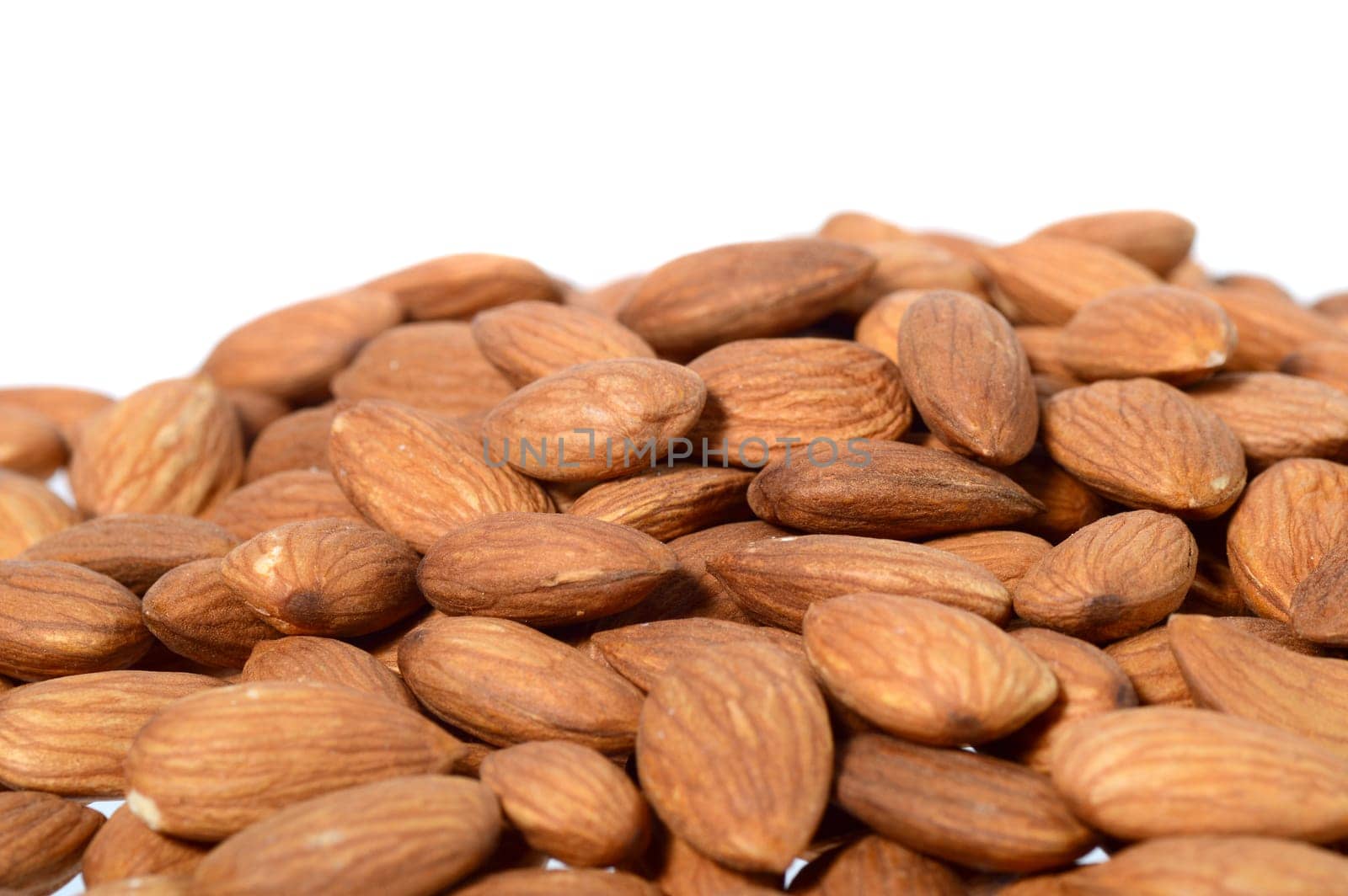 Tasty almonds nuts isolated on white background