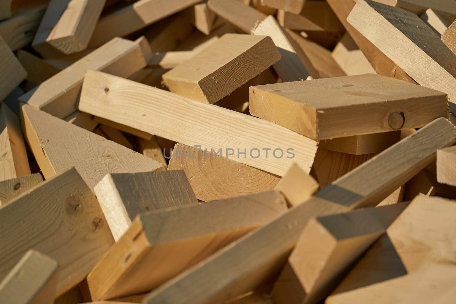 Remains of building material made of wood on the storage yard for processing in a pellet plant in the north of the city of Magdeburg in Germany