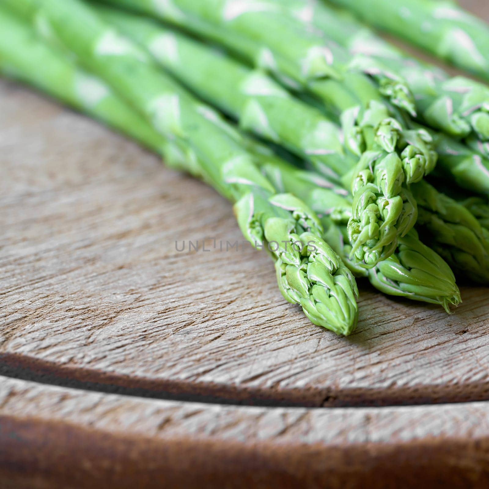 fresh green asparagus from an asparagus field as an ingredient in a kitchen