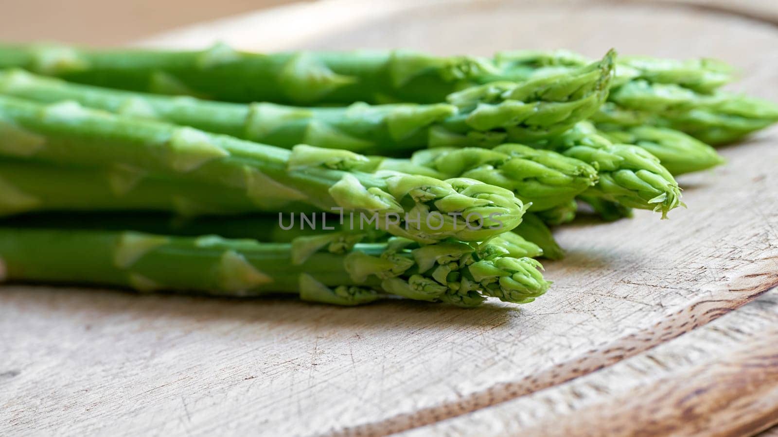 fresh green asparagus from an asparagus field as an ingredient in a kitchen