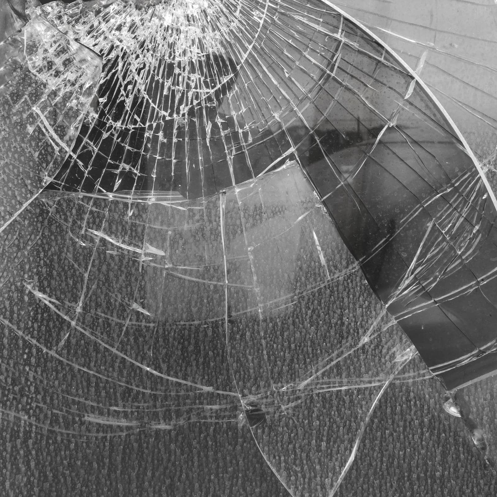 Broken glass with big hole. It can be used as backgrounds and concepts.