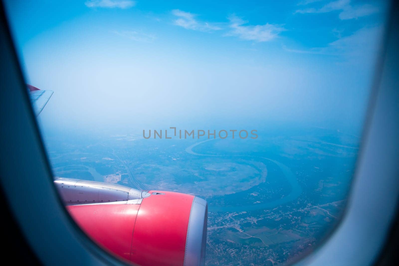 Sky view from airplane. Aerial view from windows. Transportation Concept.