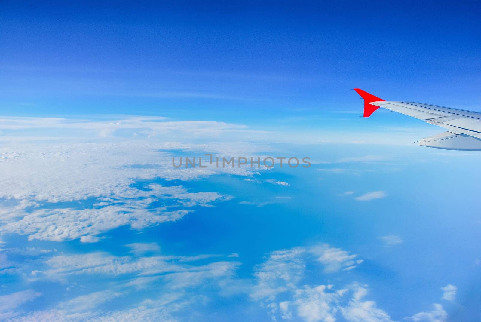 Sky view from airplane. Aerial view from windows. Transportation Concept.