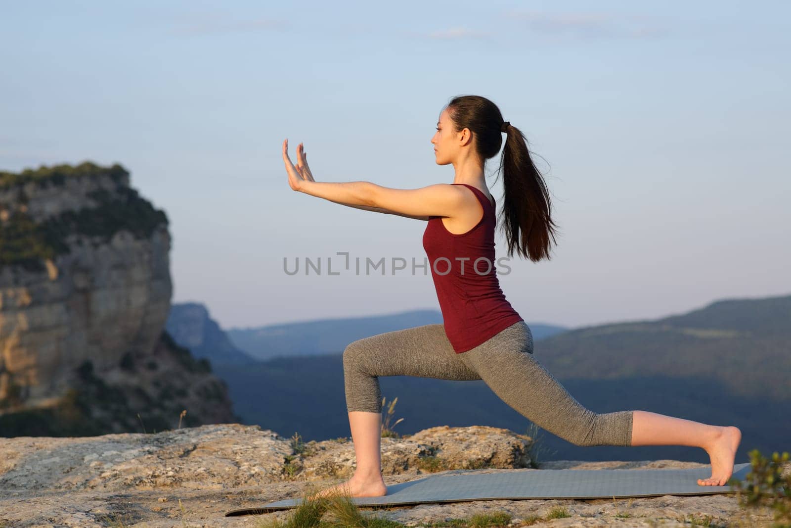 Asian woman practicing tai chi exercise outdoors