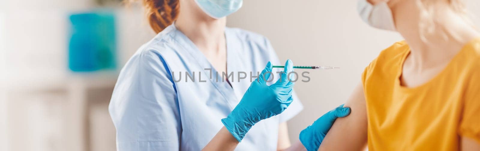 Nurse giving vaccine syringe against Covid 19 to patient. Concept immunization and vaccinating from pandemic of SARS.