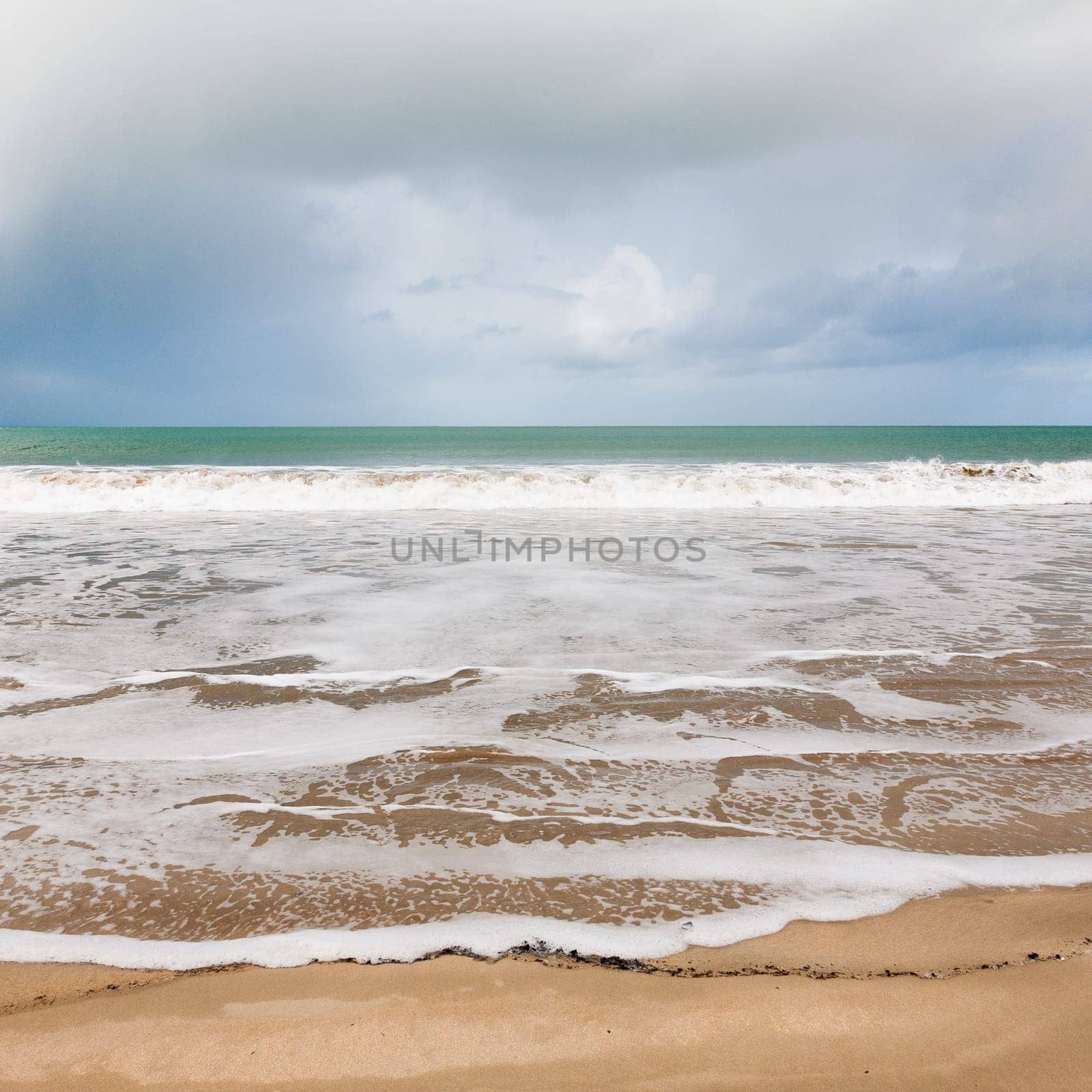 Soft wave of the sea on the sandy beach in Brittany, France