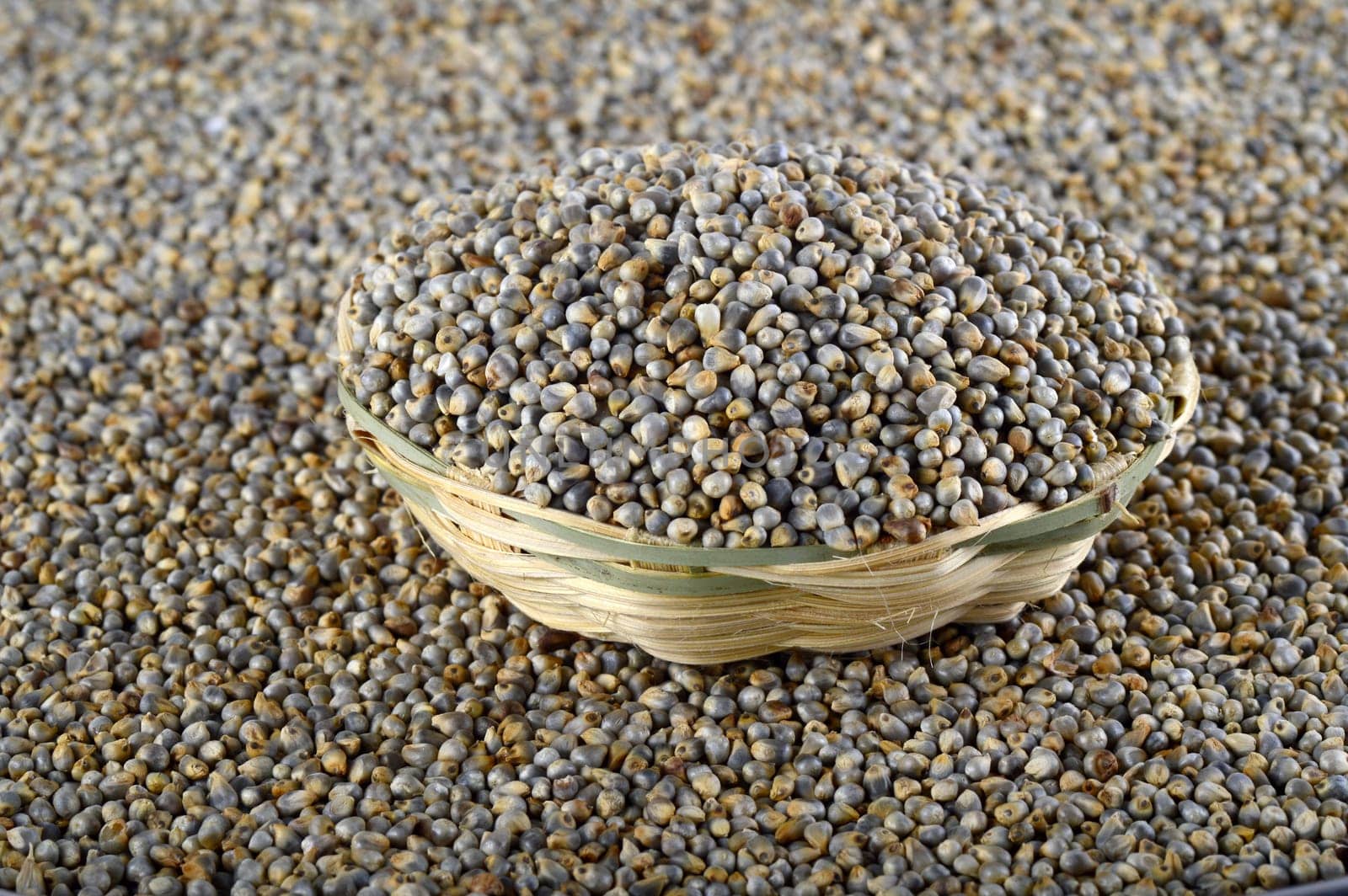Bajra (Pearl millet) in wooden (bamboo) basket