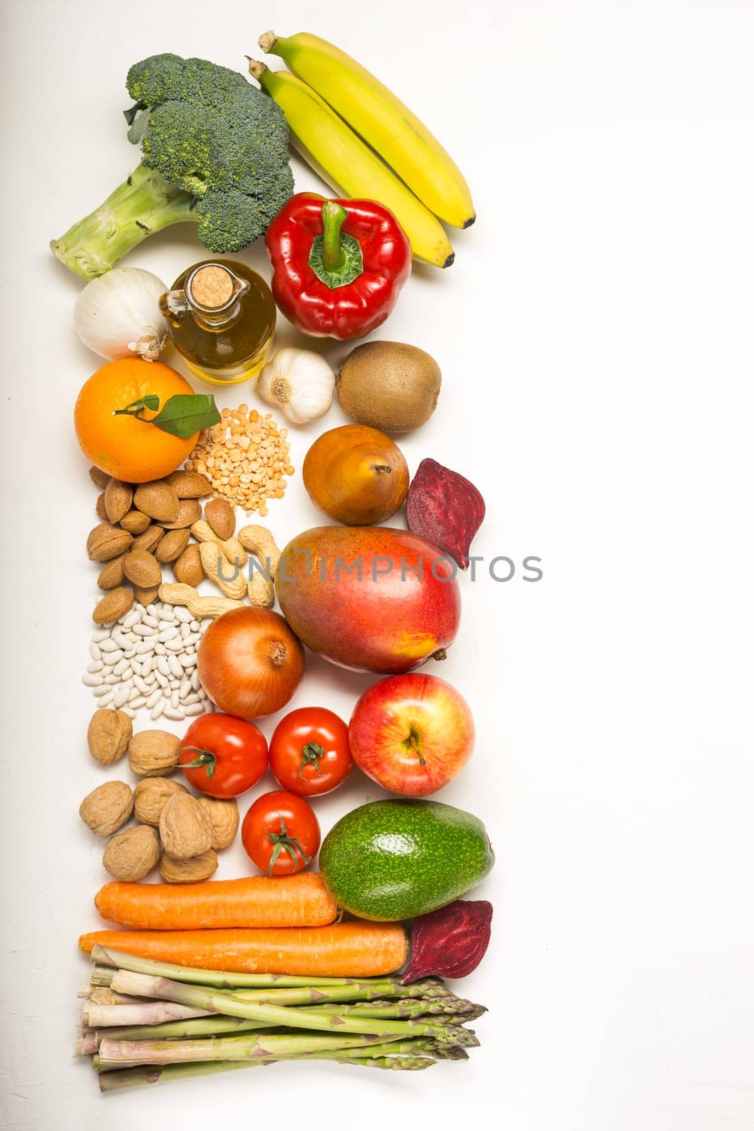 Healthy food clean eating selection: fruit, vegetable, seeds, superfood, cereals, leaf vegetable on white with copy space. Diet concept. Flat lay, top view