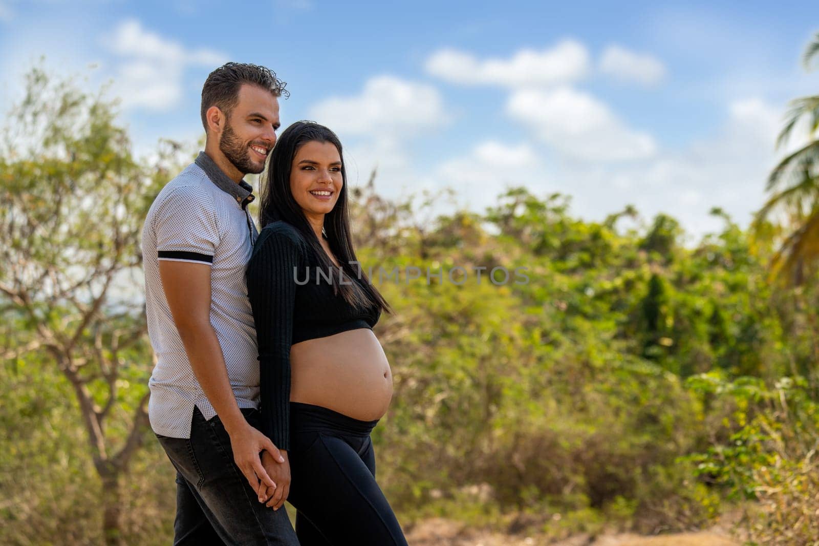 Photo of a young couple, the girl is pregnant