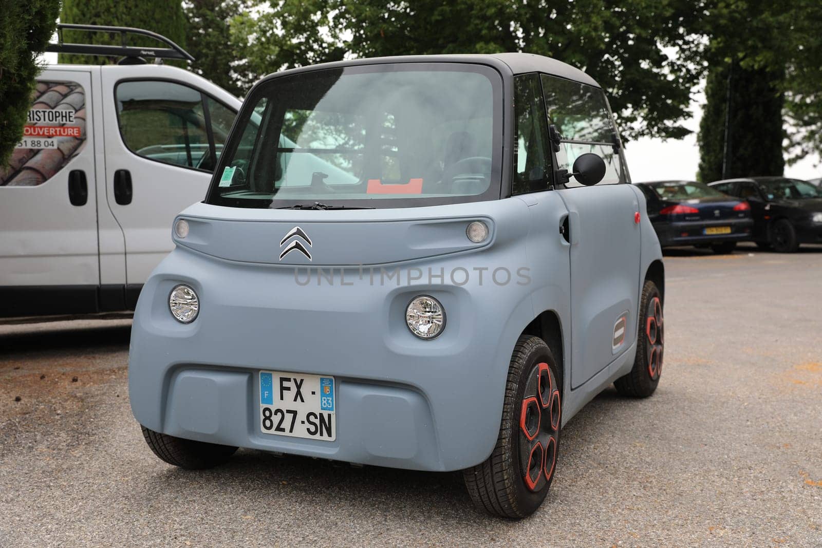 Seillans, France - June 19, 2021: French Small Citroen Ami Electric Two-Seater Micro-City Car Parked In The Street Of Seillans In The South Of France, Europe. Close Up Front View .