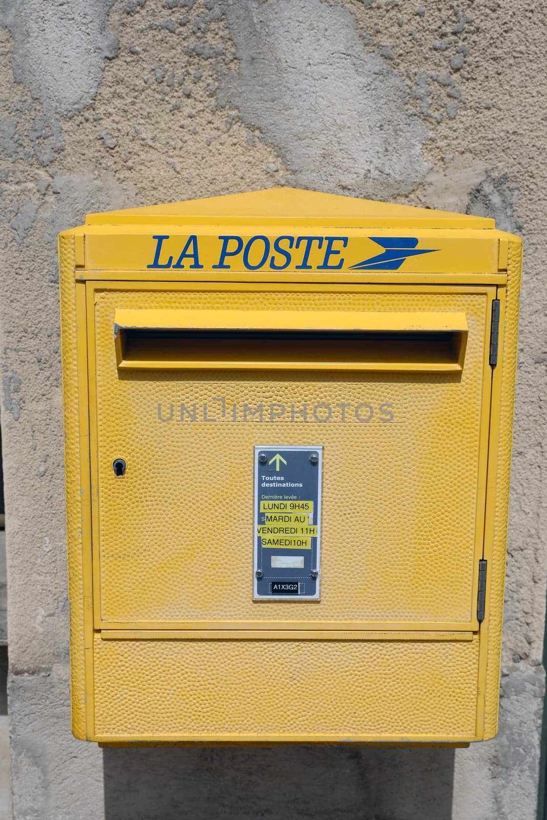 Seillans, France - June 19, 2021: La Poste, A French Yellow Post Box In The Street Of Seillans In The South Of France, Europe. Close Up View