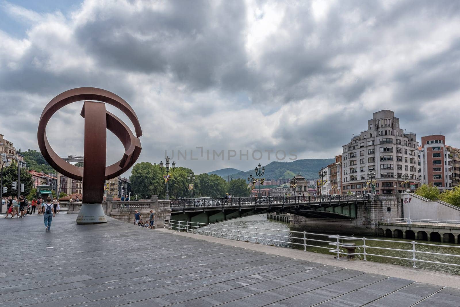 bilbao downtown with nervion river and boardwalk area, basque country, spain