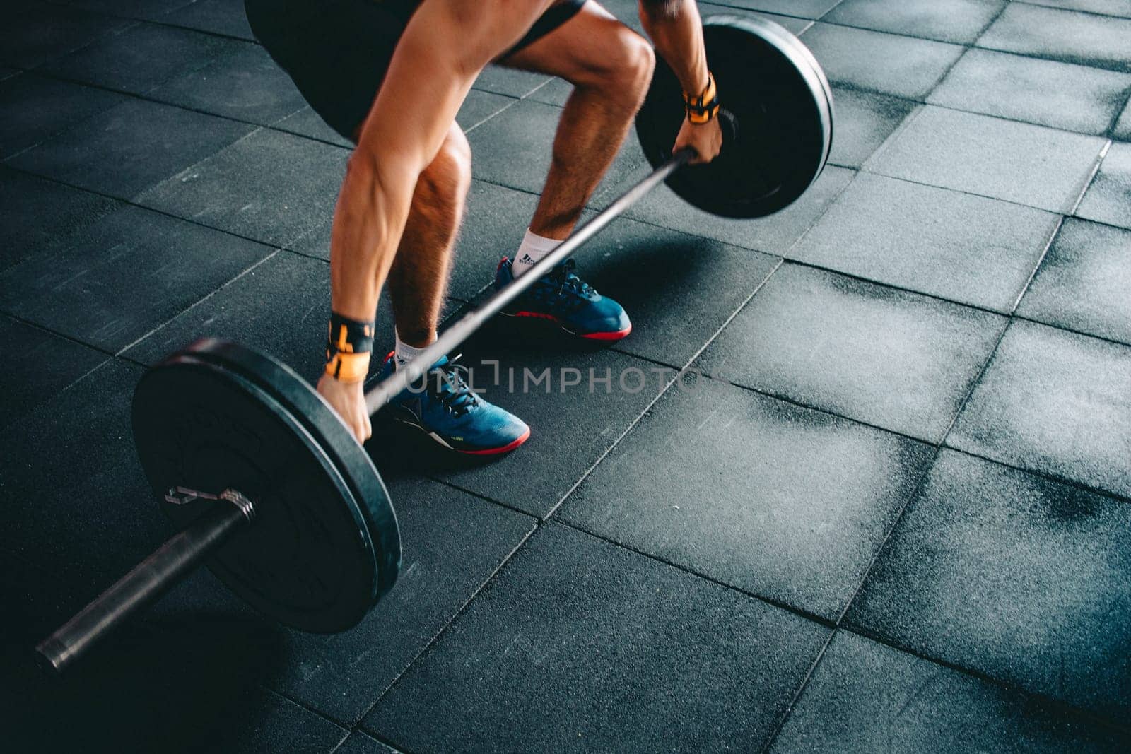 a crossfit athlete performing exercise in gym